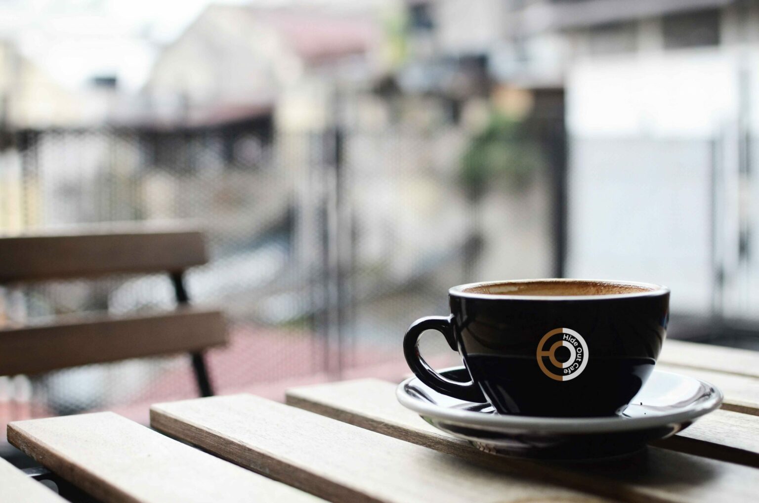 Hideout Cafe branded coffee cup